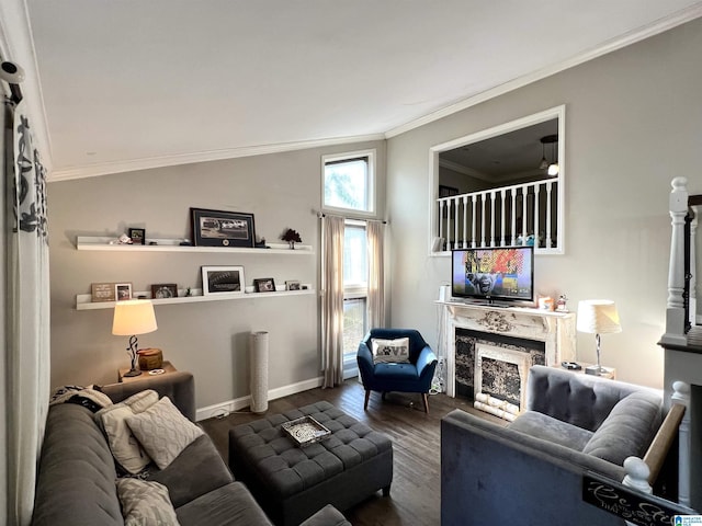 living room with dark wood-style flooring, a premium fireplace, baseboards, and ornamental molding