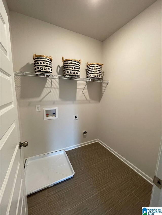 laundry room with hookup for an electric dryer, laundry area, baseboards, and hookup for a washing machine