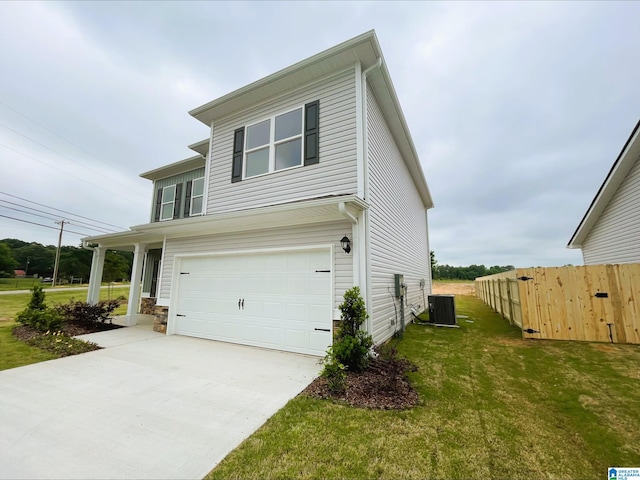 view of front of property with fence, a front lawn, a garage, central air condition unit, and driveway