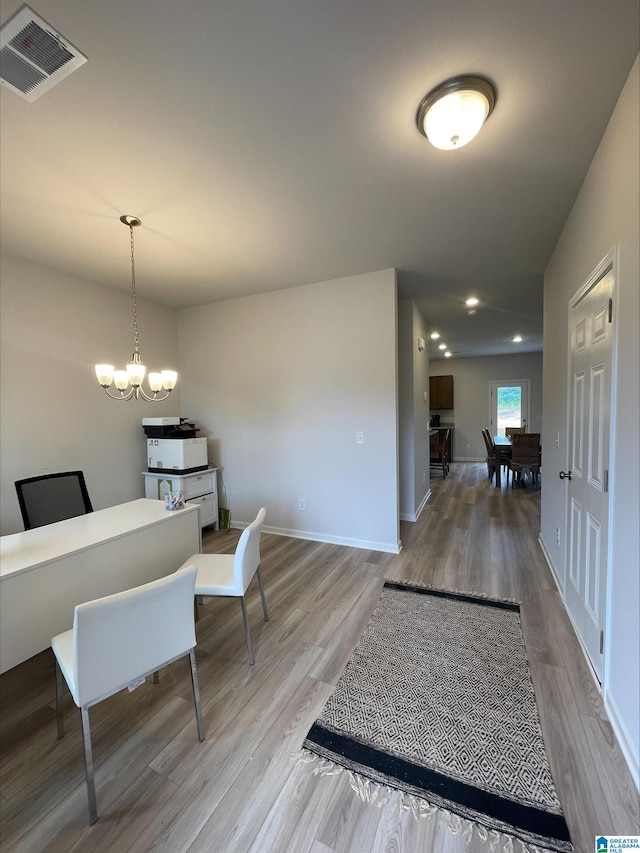 interior space with visible vents, baseboards, light wood finished floors, a chandelier, and recessed lighting