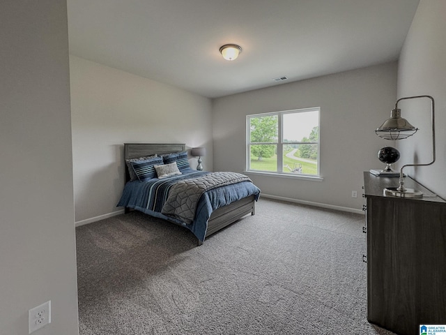 carpeted bedroom with baseboards and visible vents
