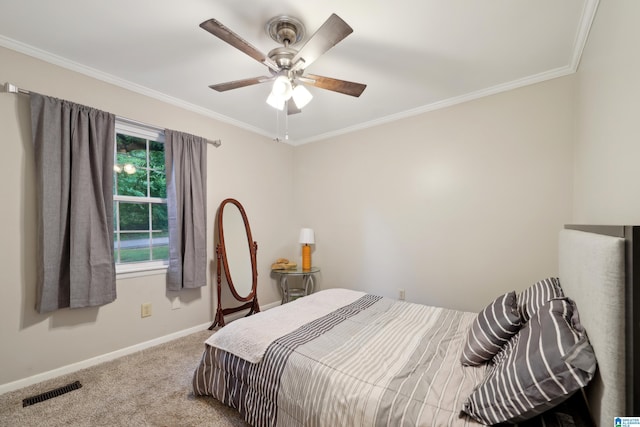 2105 NE 5th St NE, Center Point, AL 35215 - bedroom featuring a ceiling fan, visible vents, crown molding, carpet floors, and baseboards
