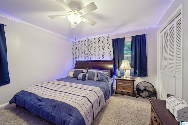 2105 NE 5th St NE, Center Point, AL 35215 - carpeted bedroom with a closet, ornamental molding, baseboards, and ceiling fan