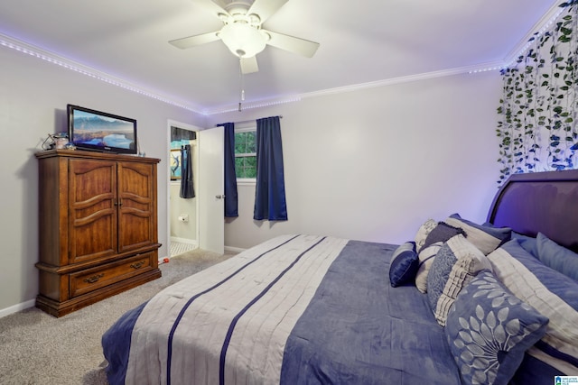 2105 NE 5th St NE, Center Point, AL 35215 - carpeted bedroom featuring baseboards, ornamental molding, a ceiling fan, and ensuite bath