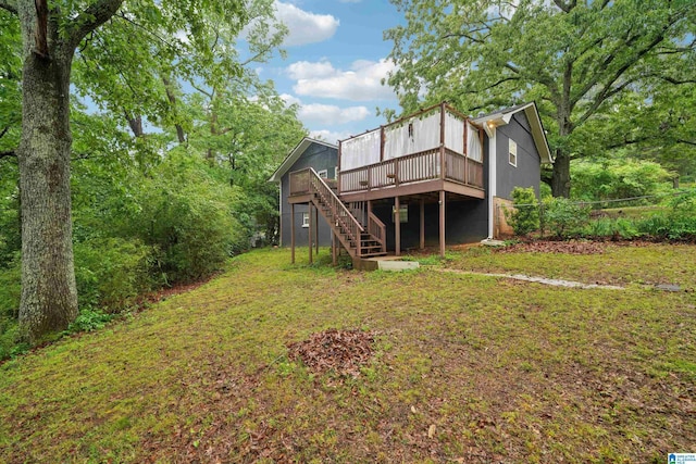 2105 NE 5th St NE, Center Point, AL 35215 - rear view of house featuring a lawn, stairway, and a deck