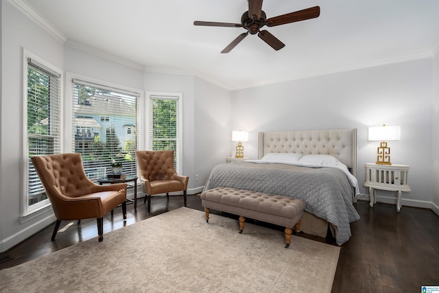 bedroom featuring crown molding, a ceiling fan, baseboards, wood finished floors, and visible vents