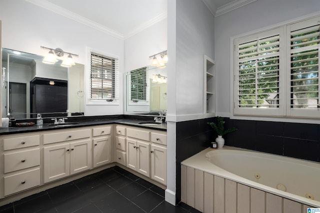 full bathroom featuring a sink, tile patterned floors, a whirlpool tub, and double vanity