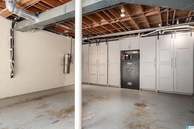 garage with concrete block wall