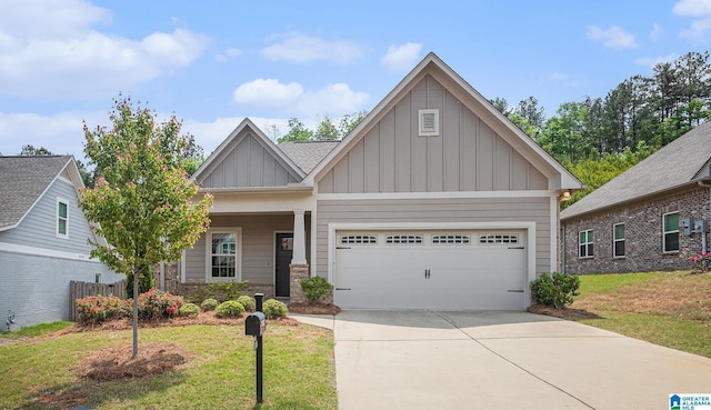 craftsman-style house featuring an attached garage, board and batten siding, a front yard, and concrete driveway