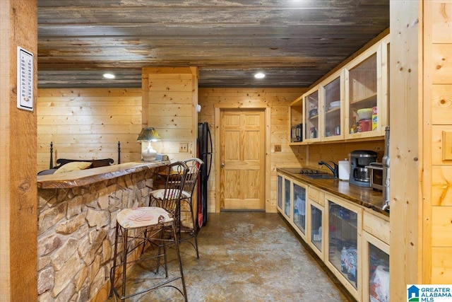 239 Gilliland Rd, Oneonta, AL 35121 - bar with a sink, wooden ceiling, a dry bar, and concrete flooring