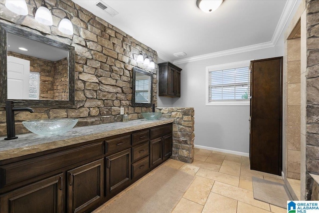 239 Gilliland Rd, Oneonta, AL 35121 - full bath featuring visible vents, crown molding, double vanity, baseboards, and a sink