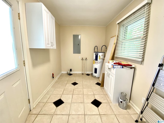 laundry room featuring water heater, plenty of natural light, electric panel, and light tile patterned flooring