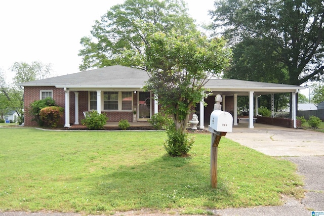 602 Riddle Ave, Piedmont, AL 36272 - single story home featuring a porch, driveway, a front yard, and a carport