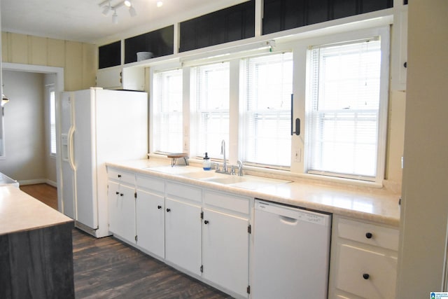 602 Riddle Ave, Piedmont, AL 36272 - kitchen featuring a sink, light countertops, white cabinets, white appliances, and dark wood-type flooring
