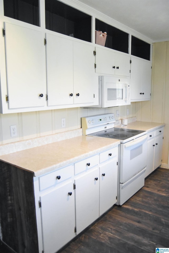 602 Riddle Ave, Piedmont, AL 36272 - kitchen with light countertops, white cabinets, dark wood-style flooring, and white appliances