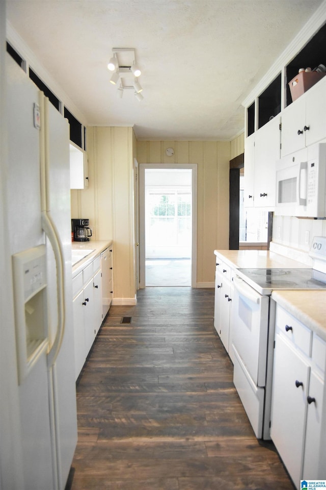 602 Riddle Ave, Piedmont, AL 36272 - kitchen featuring white appliances, white cabinetry, dark wood finished floors, and light countertops