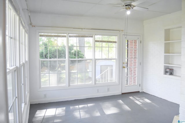 602 Riddle Ave, Piedmont, AL 36272 - unfurnished sunroom with brick wall and a healthy amount of sunlight