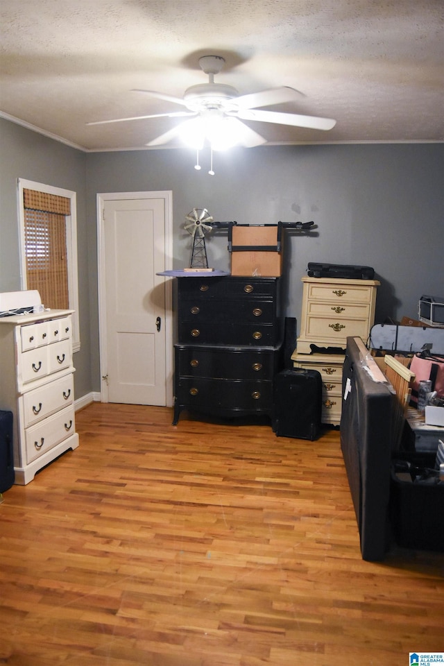602 Riddle Ave, Piedmont, AL 36272 - bedroom featuring ceiling fan, light wood-type flooring, and a textured ceiling