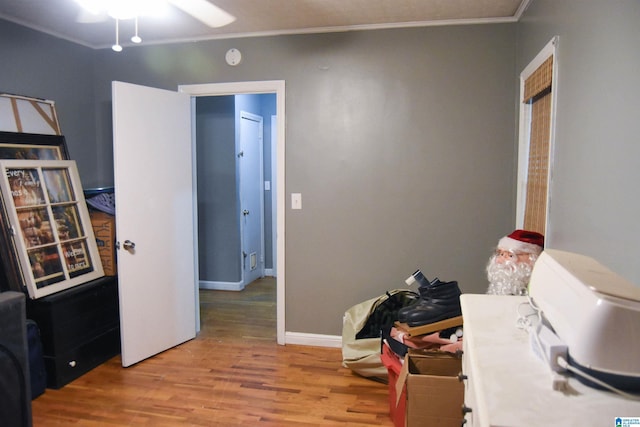 602 Riddle Ave, Piedmont, AL 36272 - interior space with crown molding, a ceiling fan, baseboards, and wood finished floors