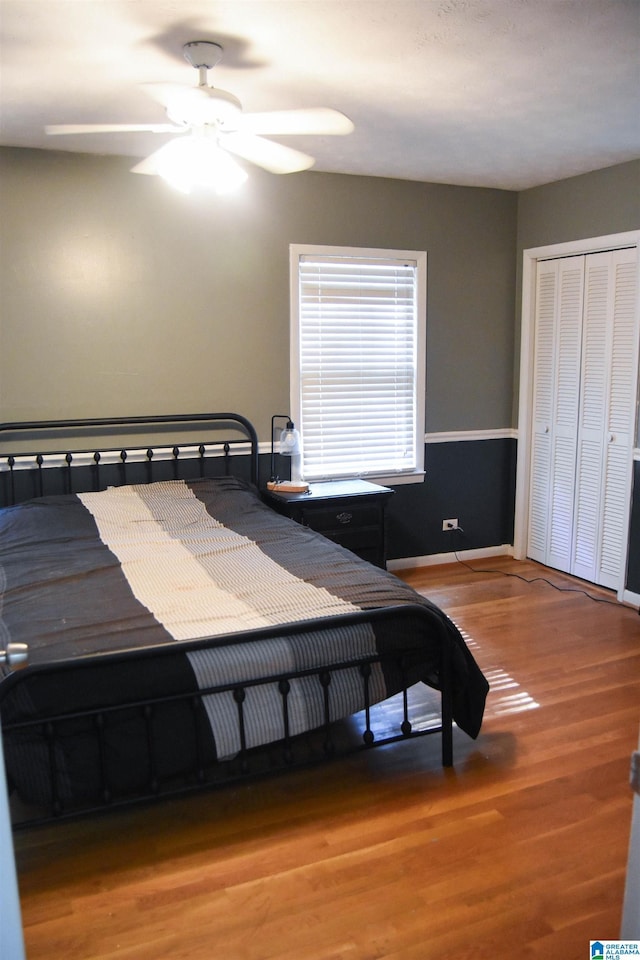 602 Riddle Ave, Piedmont, AL 36272 - bedroom with a ceiling fan, baseboards, wood finished floors, and a closet