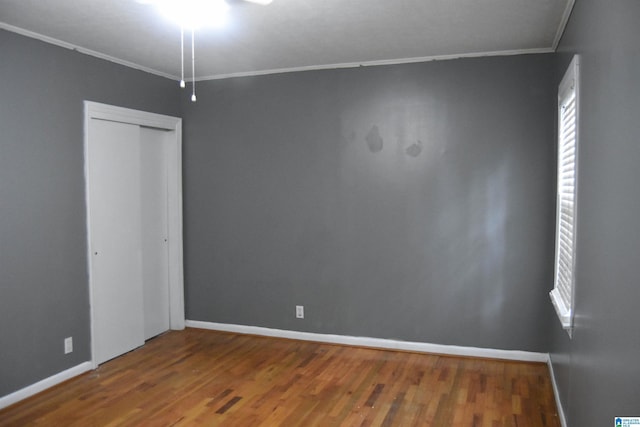 602 Riddle Ave, Piedmont, AL 36272 - spare room with crown molding, baseboards, and wood finished floors