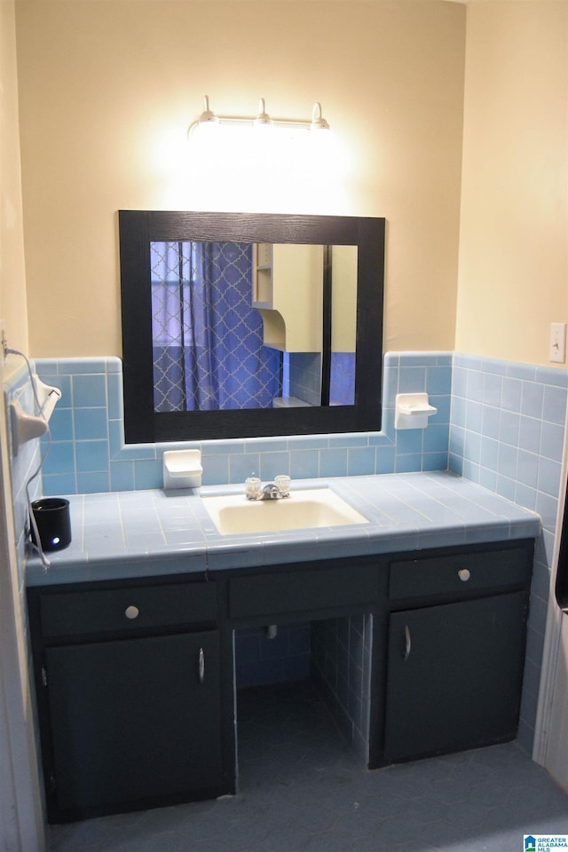 602 Riddle Ave, Piedmont, AL 36272 - bathroom featuring tile walls, a wainscoted wall, and vanity