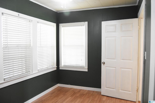 602 Riddle Ave, Piedmont, AL 36272 - spare room featuring baseboards, ornamental molding, and light wood finished floors