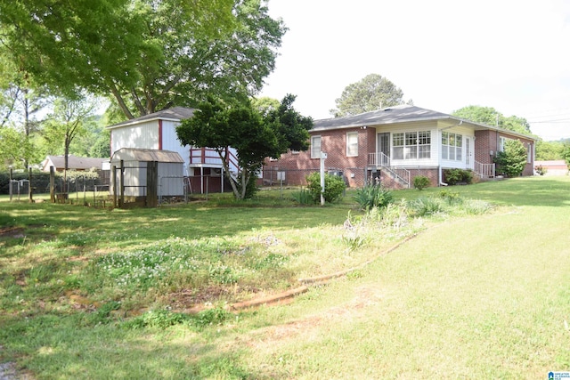 602 Riddle Ave, Piedmont, AL 36272 - view of yard featuring fence, an outbuilding, and a storage unit