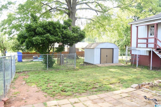 602 Riddle Ave, Piedmont, AL 36272 - view of yard with a fenced backyard, an outbuilding, and a storage shed