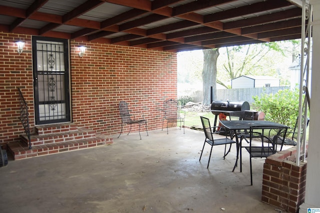 602 Riddle Ave, Piedmont, AL 36272 - view of patio / terrace featuring entry steps, fence, outdoor dining space, and a grill