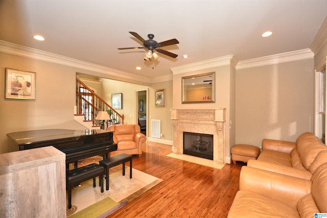 1103 Greystone Cove Dr, Hoover, AL 35242 - living area with crown molding, a ceiling fan, stairs, and a fireplace