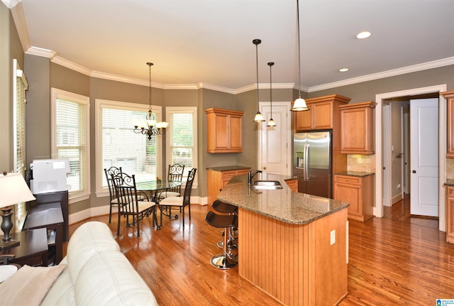 1103 Greystone Cove Dr, Hoover, AL 35242 - kitchen with baseboards, a sink, wood finished floors, and stainless steel fridge with ice dispenser