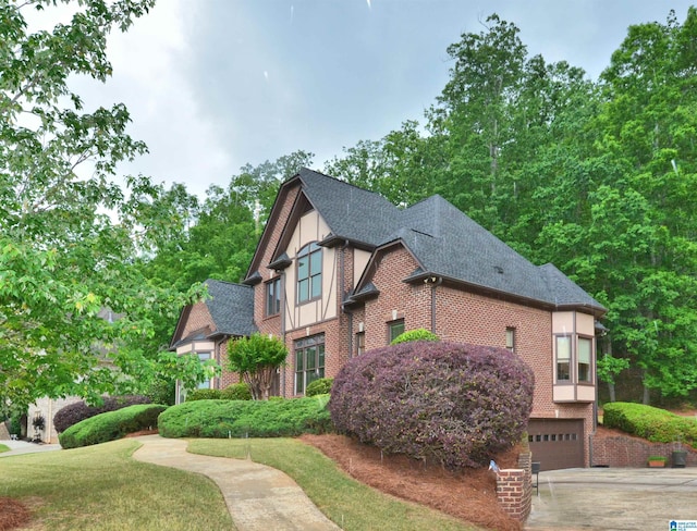 1103 Greystone Cove Dr, Hoover, AL 35242 - view of front of home featuring brick siding, driveway, a shingled roof, and a garage