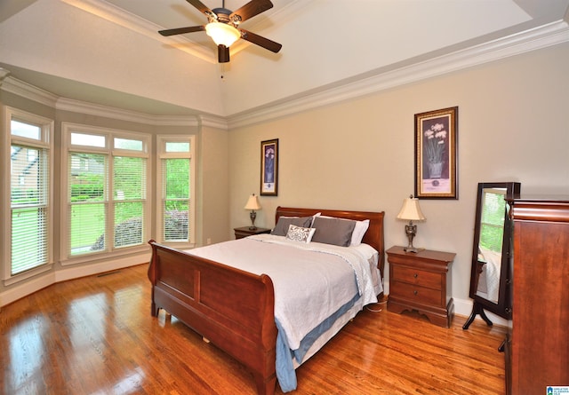 1103 Greystone Cove Dr, Hoover, AL 35242 - bedroom featuring ornamental molding, wood finished floors, baseboards, a tray ceiling, and a ceiling fan