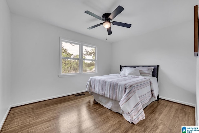 917 Forrest Dr S, Homewood, AL 35209 - bedroom featuring baseboards, a ceiling fan, wood finished floors, and visible vents