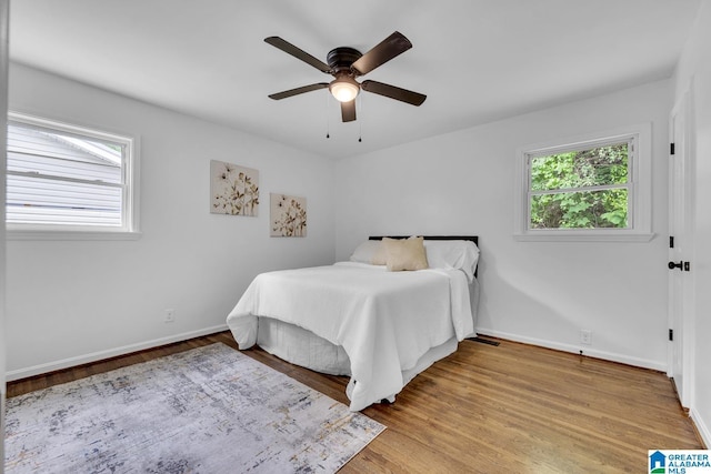 917 Forrest Dr S, Homewood, AL 35209 - bedroom featuring baseboards, light wood-style flooring, and ceiling fan