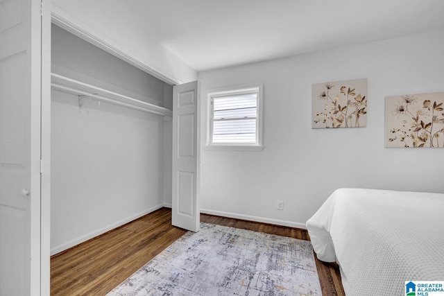 917 Forrest Dr S, Homewood, AL 35209 - bedroom with baseboards, wood finished floors, and a closet