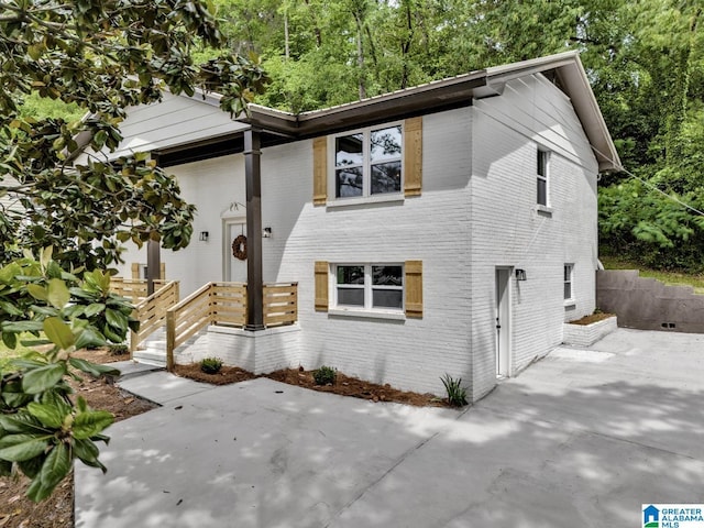 917 Forrest Dr S, Homewood, AL 35209 - view of front of home featuring brick siding and a patio area
