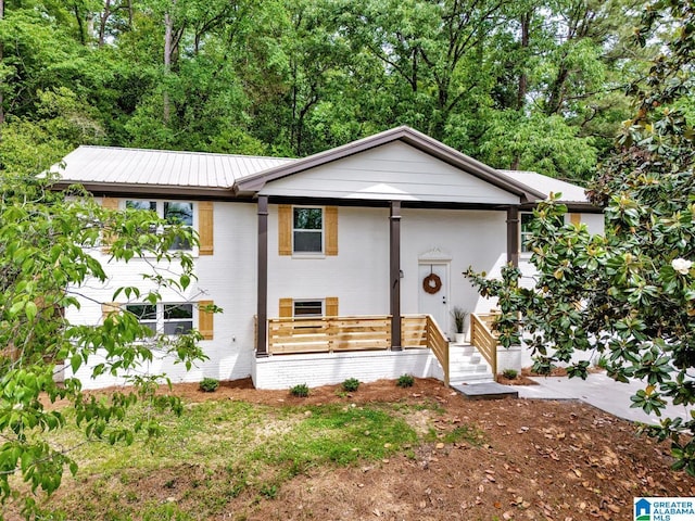 917 Forrest Dr S, Homewood, AL 35209 - view of front facade with brick siding and metal roof