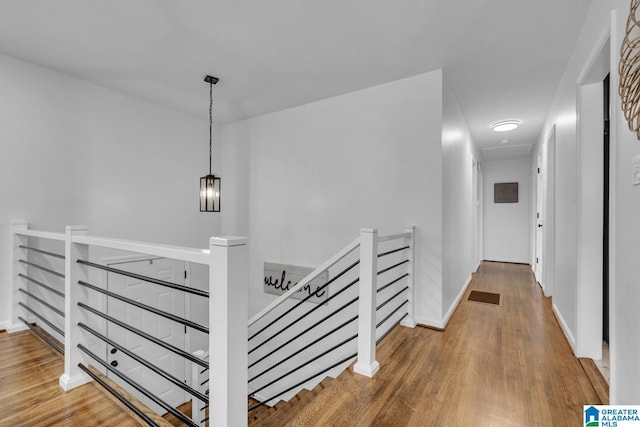917 Forrest Dr S, Homewood, AL 35209 - hallway featuring visible vents, wood finished floors, and an upstairs landing