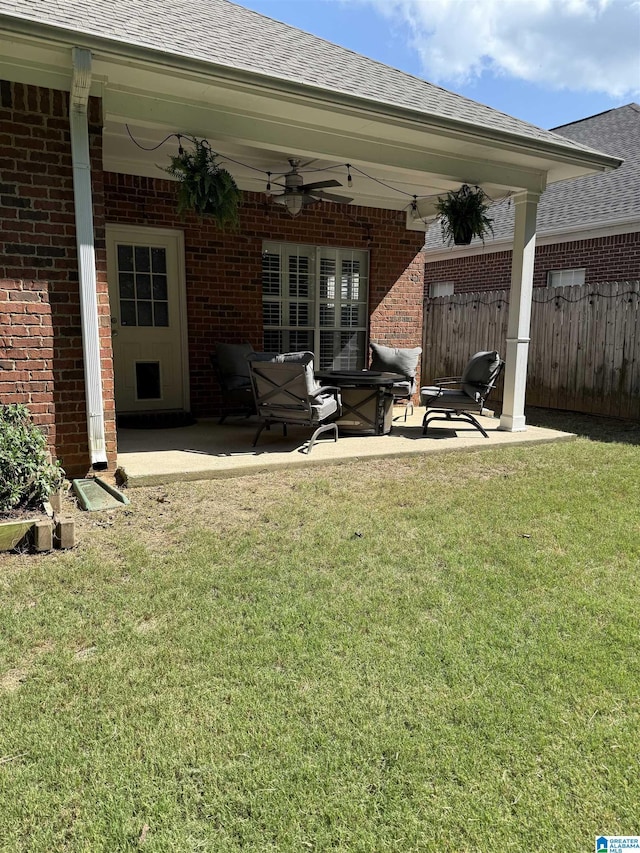 exterior space with ceiling fan and fence