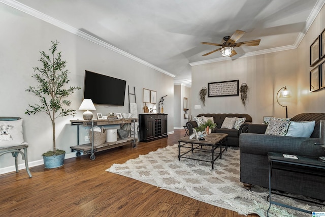 living area with crown molding, baseboards, ceiling fan, and wood finished floors