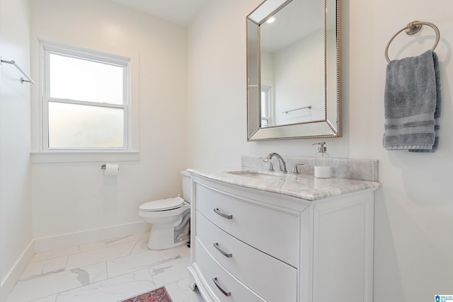 530 10th Ave S, Birmingham, AL 35205 - bathroom featuring toilet, baseboards, marble finish floor, and vanity