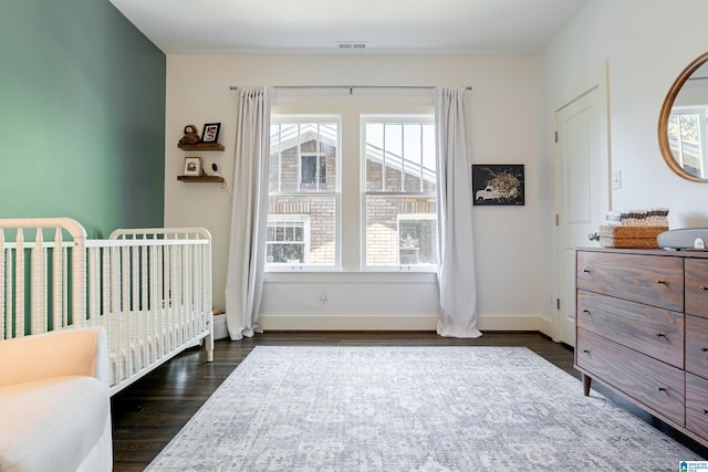 530 10th Ave S, Birmingham, AL 35205 - bedroom with multiple windows, visible vents, and dark wood-type flooring