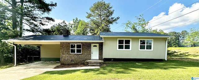 5482 Hackberry Ln N, Gadsden, AL 35903 - view of front of house with a carport, concrete driveway, and a front yard