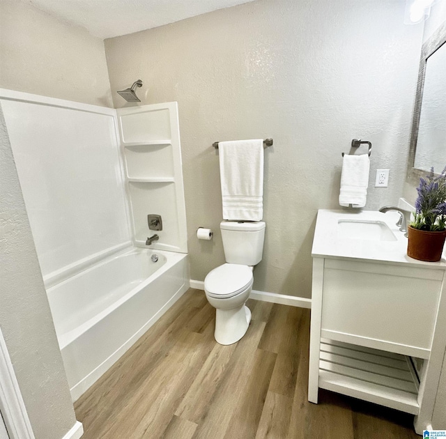 5482 Hackberry Ln N, Gadsden, AL 35903 - full bathroom featuring vanity, toilet, baseboards, wood finished floors, and  shower combination