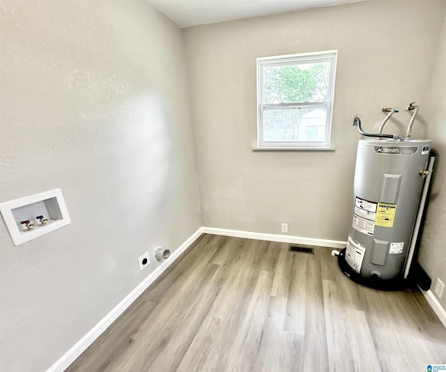 5482 Hackberry Ln N, Gadsden, AL 35903 - utility room featuring visible vents and water heater