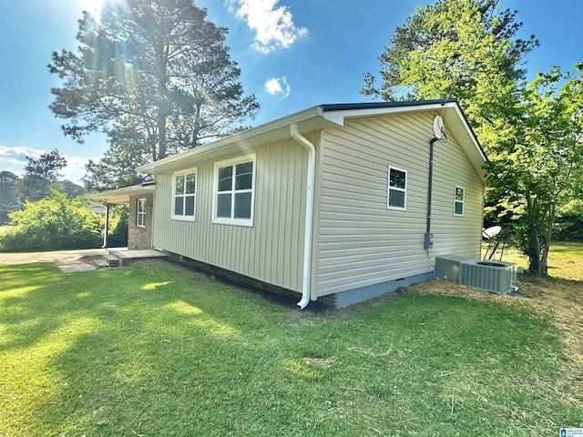 5482 Hackberry Ln N, Gadsden, AL 35903 - view of property exterior with a lawn, central AC unit, and crawl space