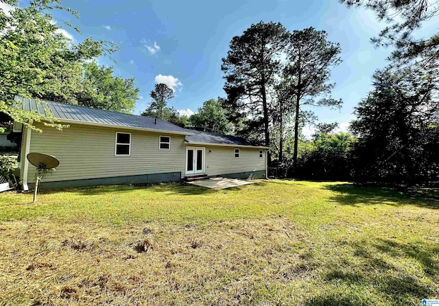 5482 Hackberry Ln N, Gadsden, AL 35903 - rear view of house featuring a lawn, crawl space, french doors, and metal roof