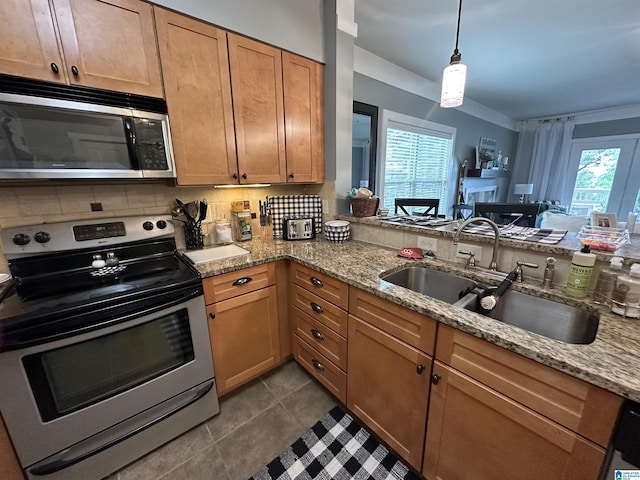 475 River Forest Ln Unit 1250, Talladega, AL 35160 - kitchen with light stone counters, a sink, decorative backsplash, and stainless steel appliances